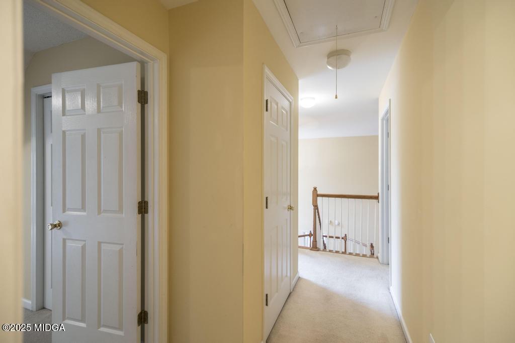 578 Edgefield Way Macon, GA 31210 - Photo 18 of 42 a view of a hallway with wooden shelves