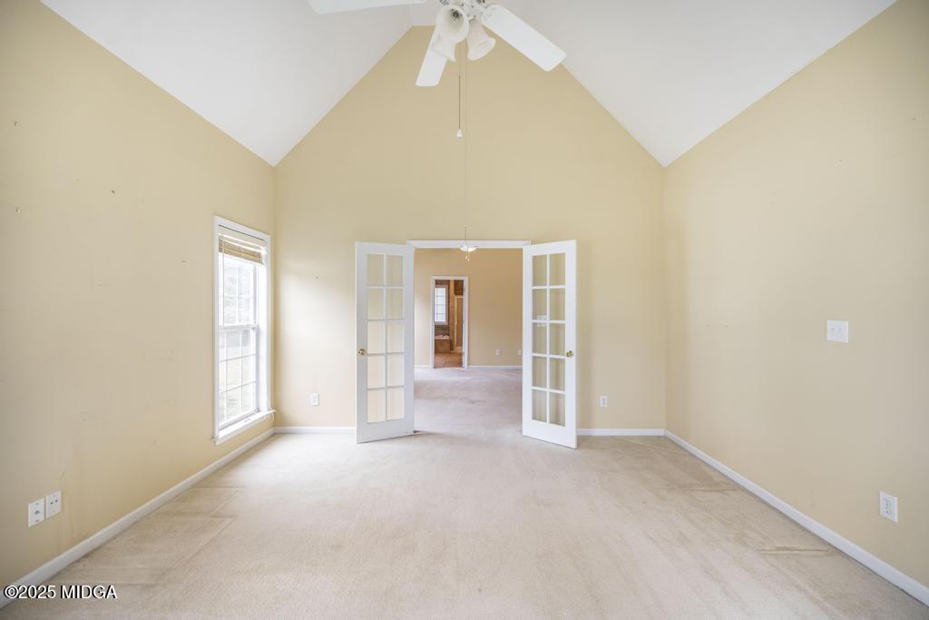 578 Edgefield Way Macon, GA 31210 - Photo 22 of 42 an empty room with windows and cabinet