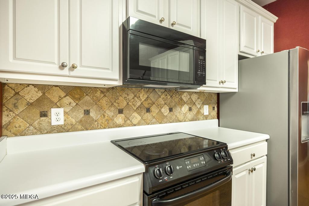 578 Edgefield Way Macon, GA 31210 - Photo 31 of 42 a stove top oven sitting inside of a kitchen