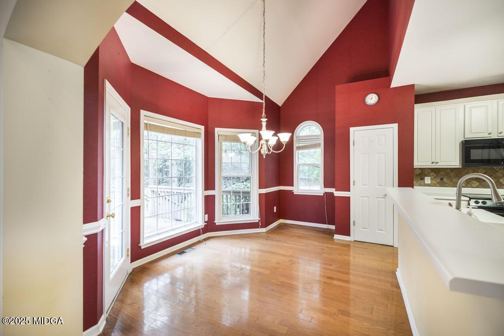 578 Edgefield Way Macon, GA 31210 - Photo 33 of 42 a spacious bedroom with a large bed and a large window