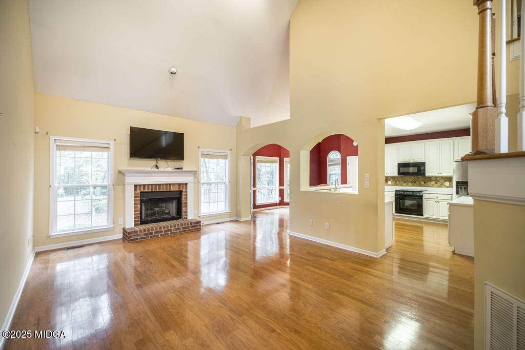 578 Edgefield Way Macon, GA 31210 - Photo 37 of 42 a view of livingroom with kitchen and fireplace