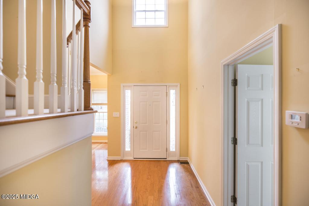 578 Edgefield Way Macon, GA 31210 - Photo 39 of 42 a view of an empty room with a window and wooden floor