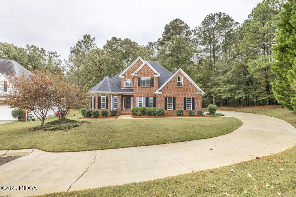 578 Edgefield Way Macon, GA 31210 - Photo 4 of 42 a front view of a house with a yard