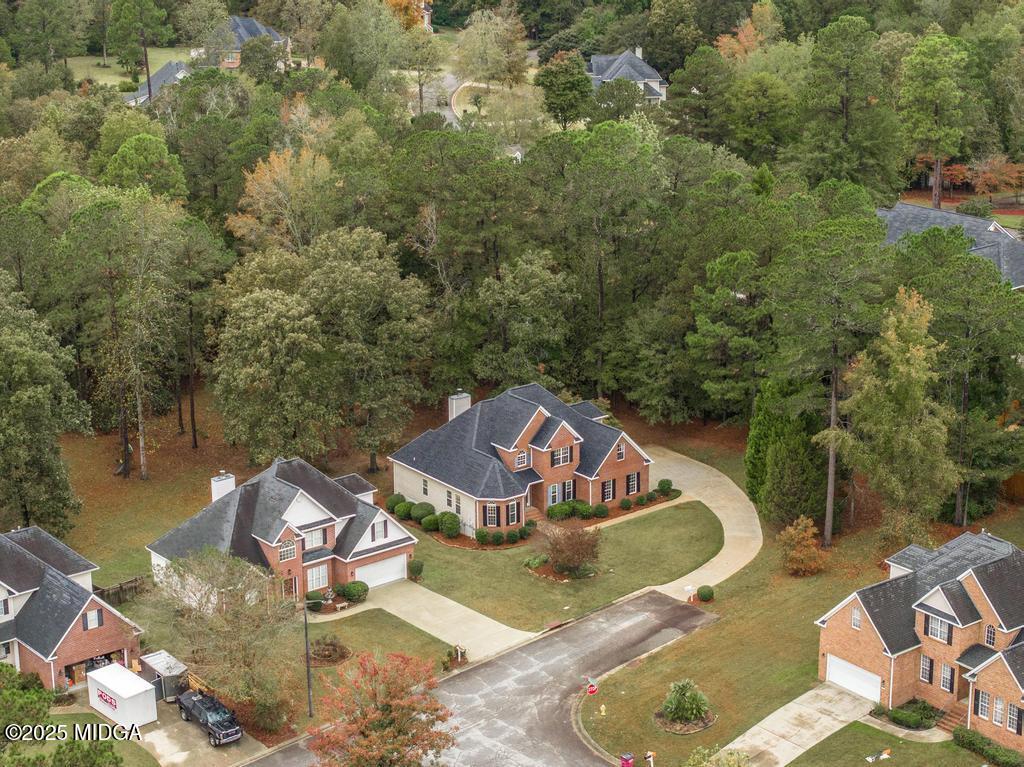 578 Edgefield Way Macon, GA 31210 - Photo 42 of 42 an aerial view of a house with swimming pool and lake view