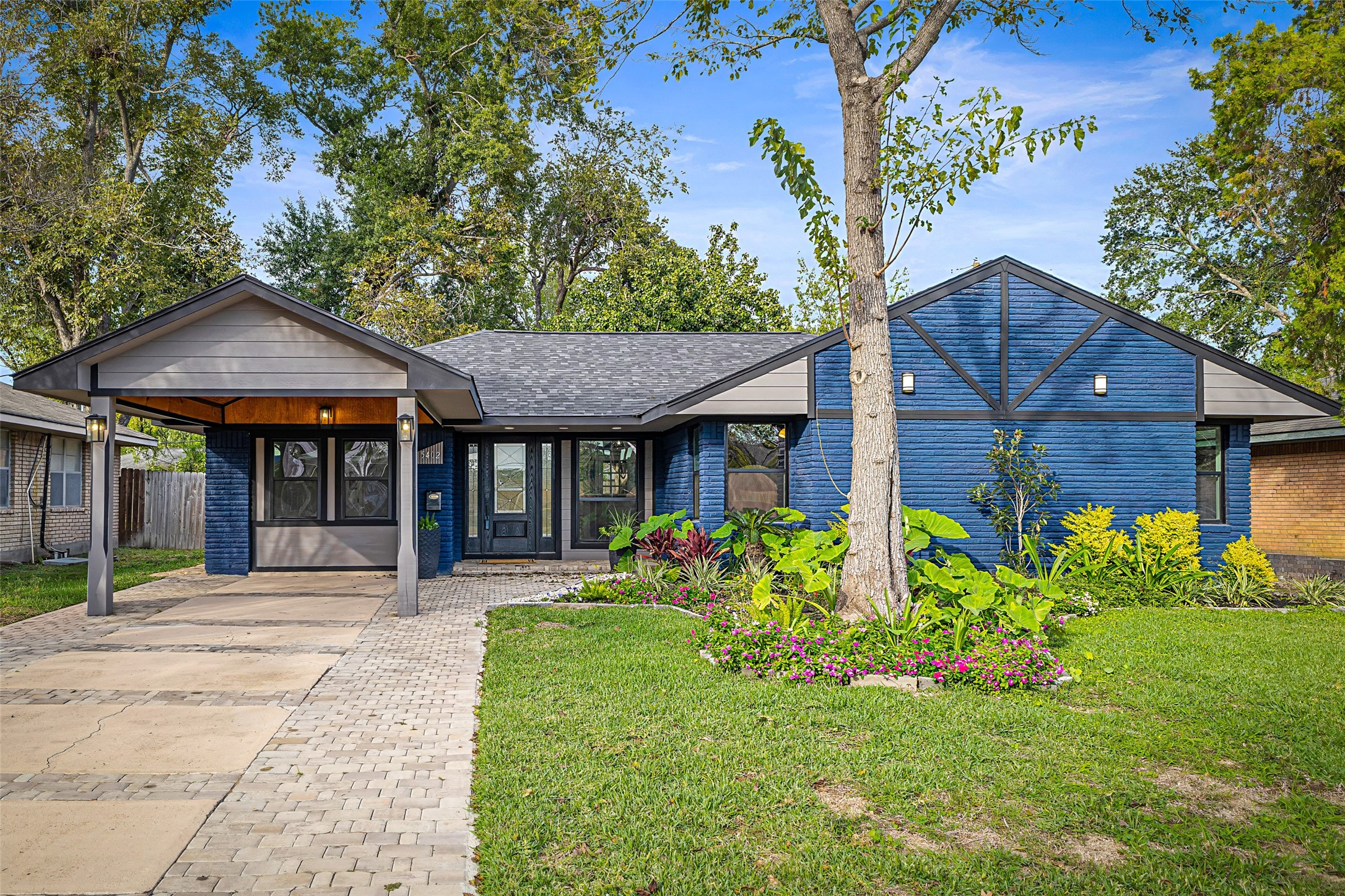 a front view of a house with garden
