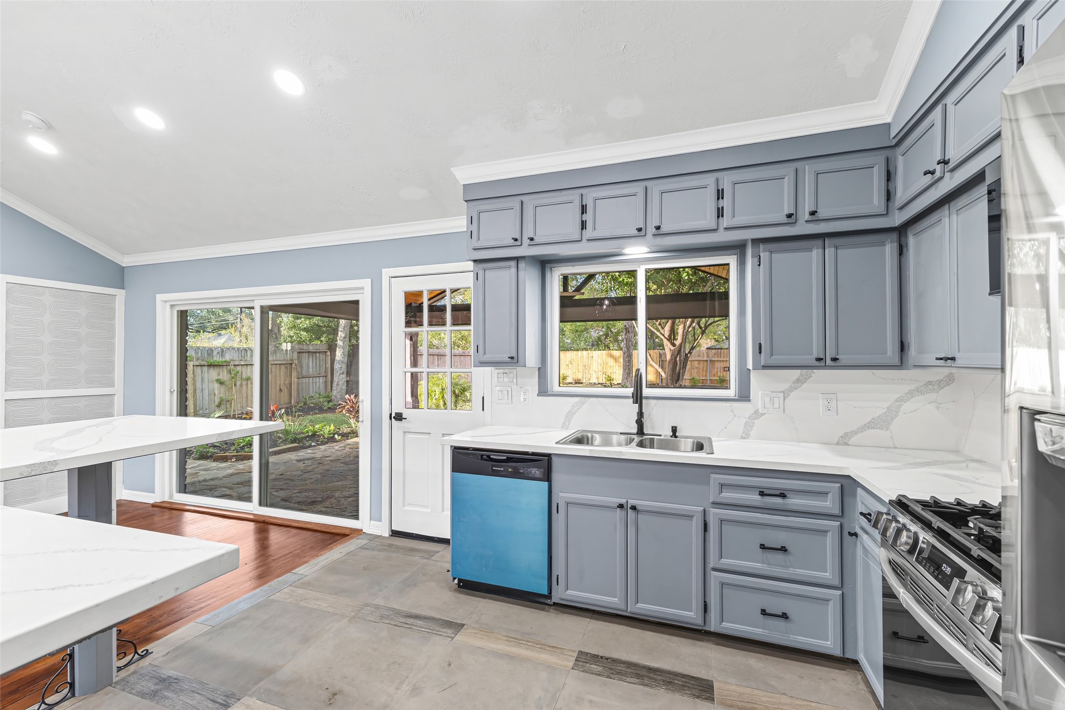 5402 Libbey Drive Houston, TX 77092 - Photo 11 of 43 a kitchen with cabinets wooden floor and a sink