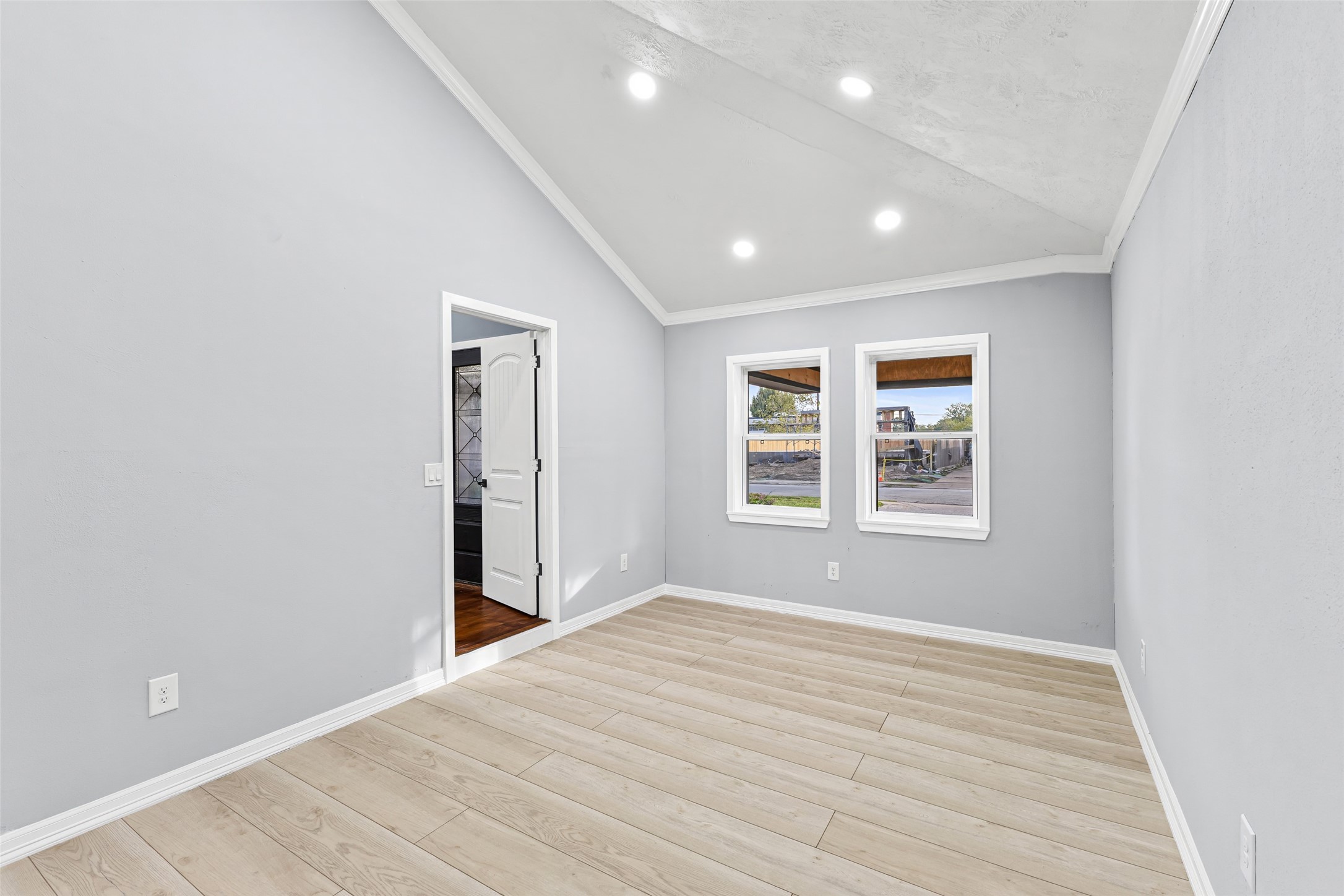 5402 Libbey Drive Houston, TX 77092 - Photo 15 of 43 a view of empty room with wooden floor and fan