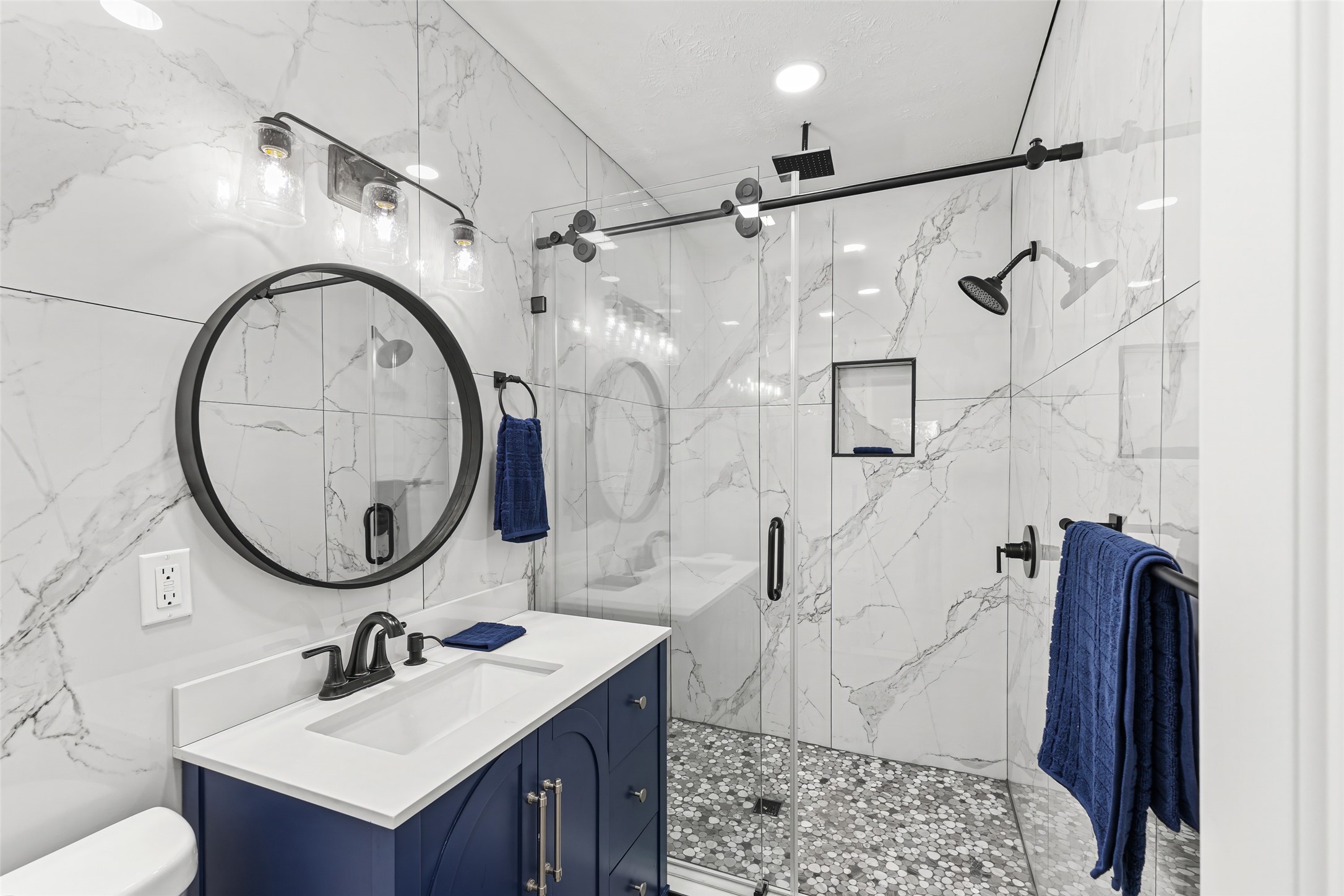 5402 Libbey Drive Houston, TX 77092 - Photo 17 of 43 a bathroom with a sink vanity mirror and toilet