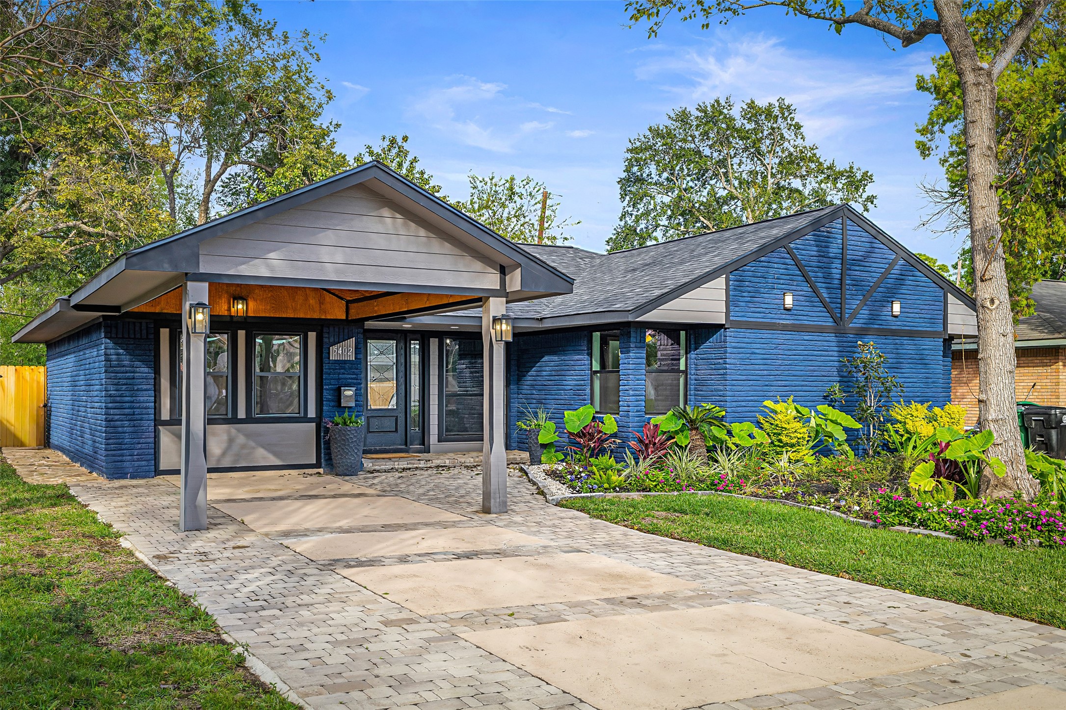 5402 Libbey Drive Houston, TX 77092 - Photo 2 of 43 a front view of a house with a garden