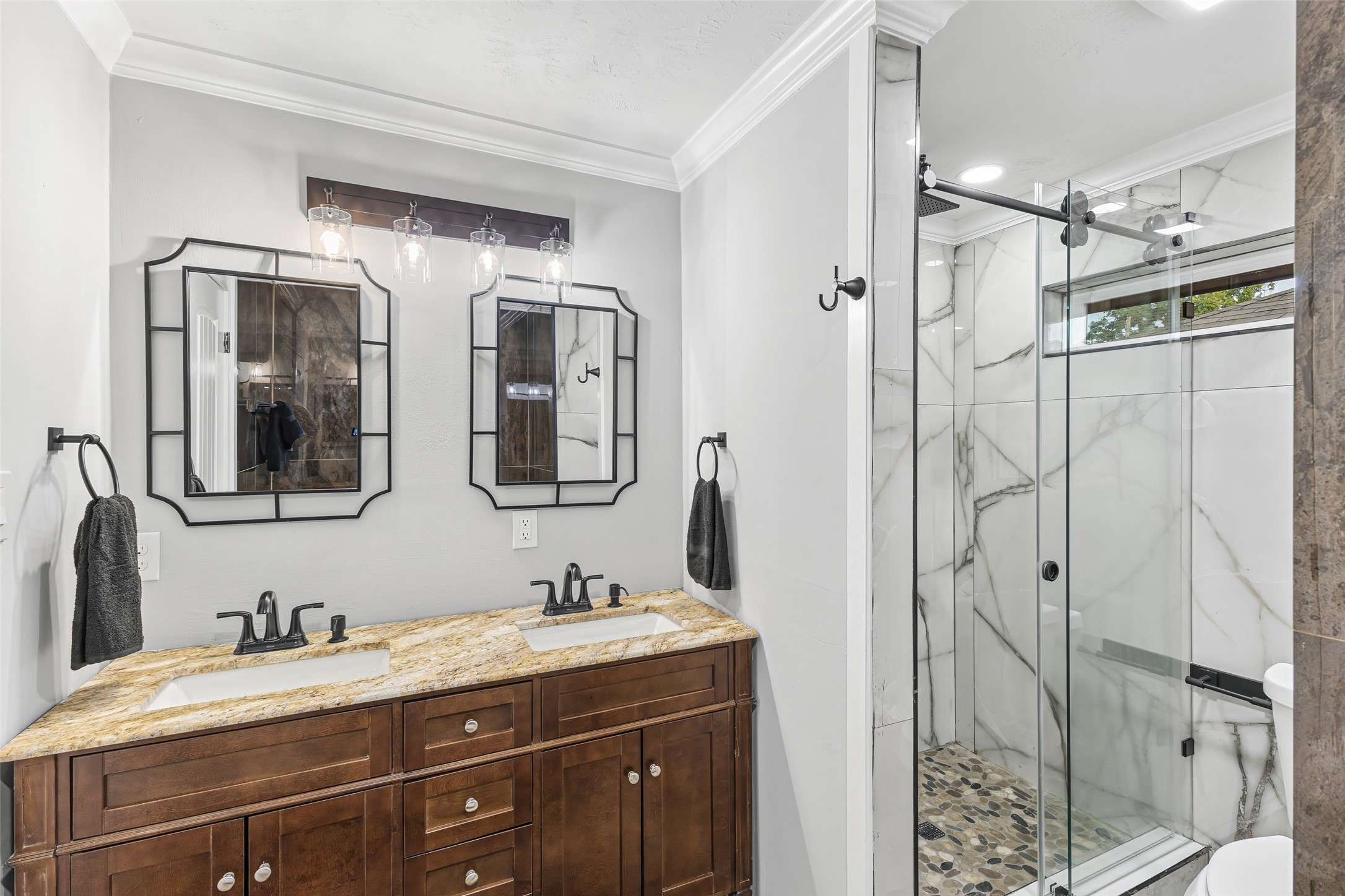 5402 Libbey Drive Houston, TX 77092 - Photo 22 of 43 a bathroom with a granite countertop sink a mirror a and a shower