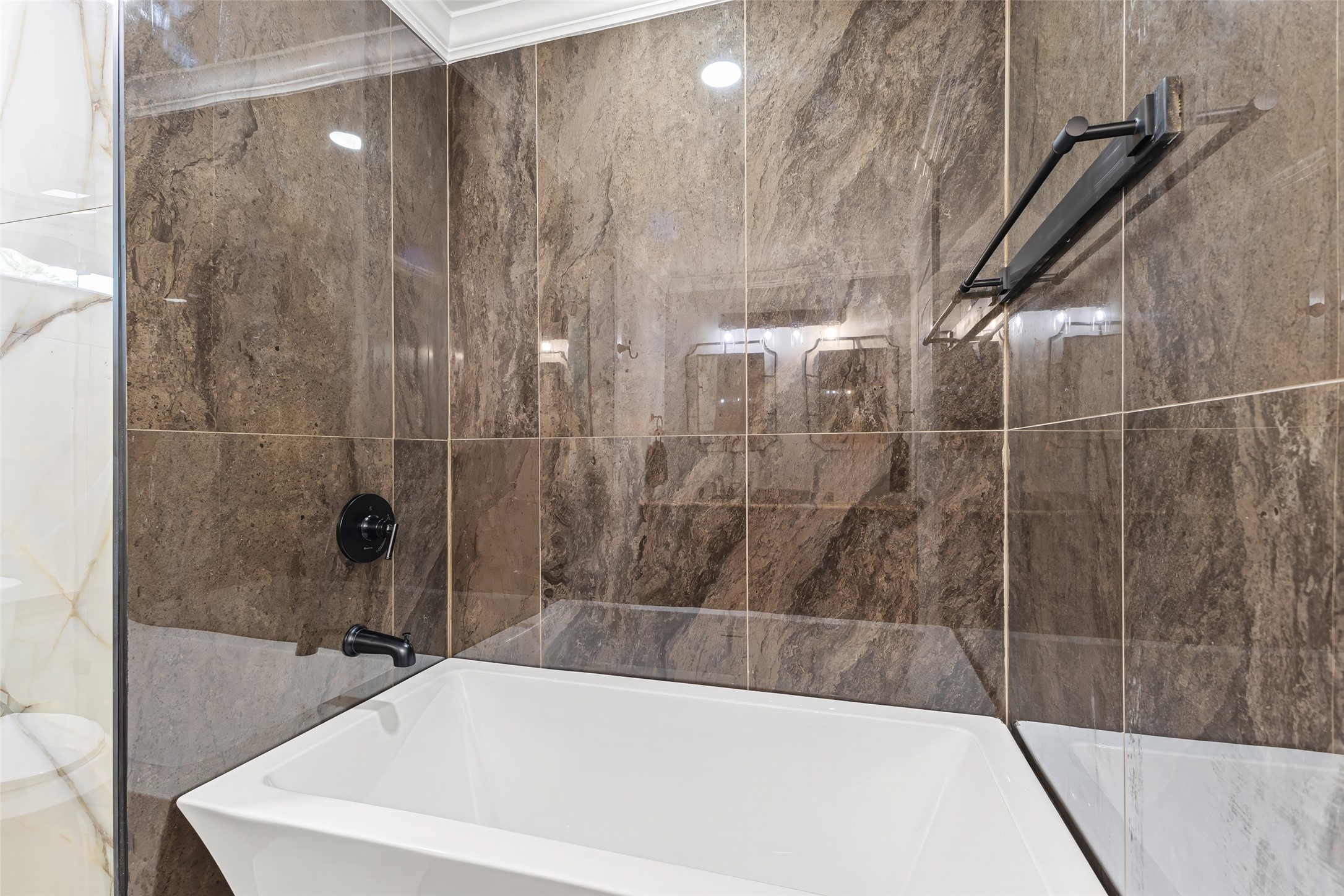 5402 Libbey Drive Houston, TX 77092 - Photo 23 of 43 a bathroom with a bathtub and a shower