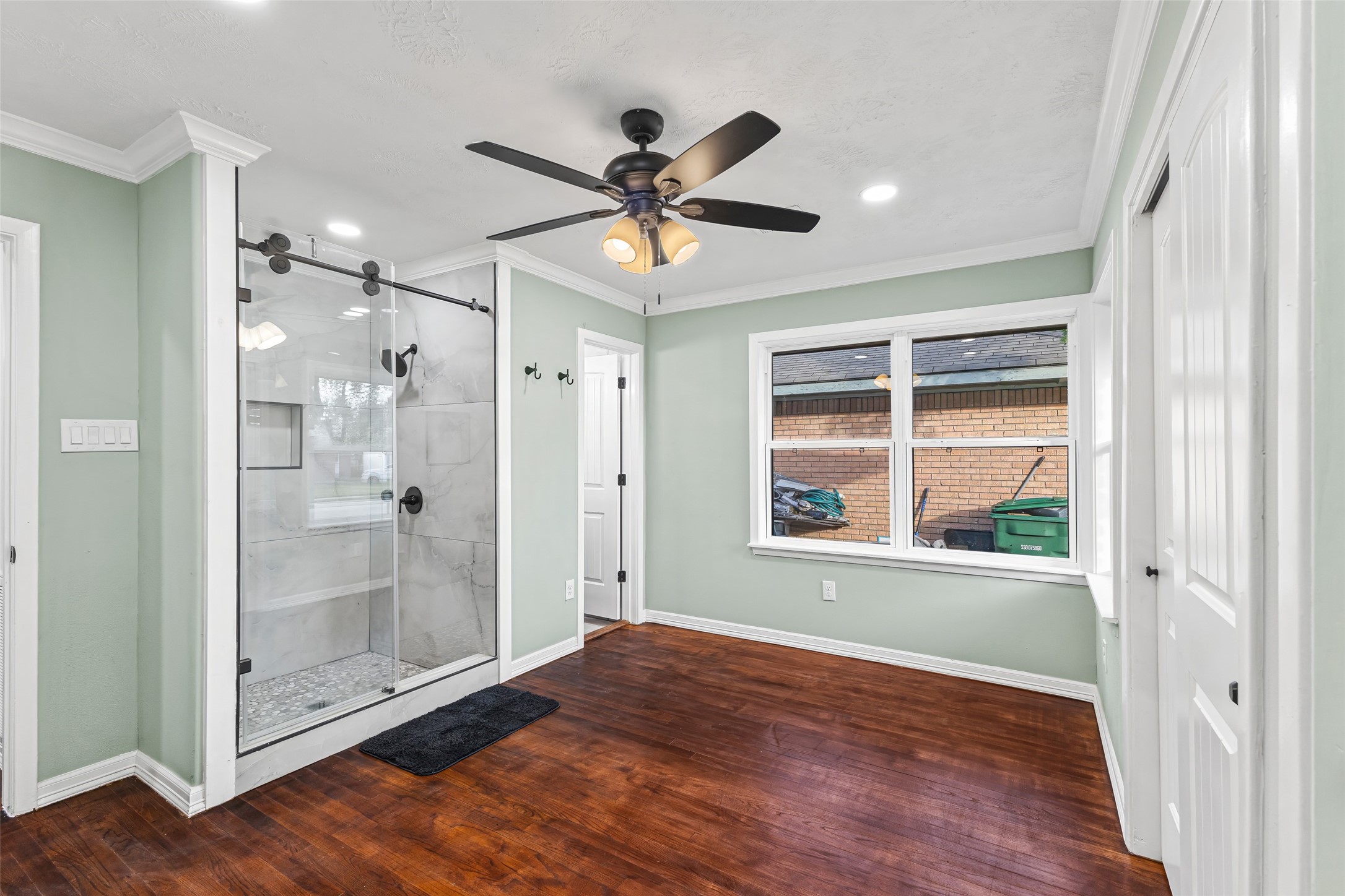 5402 Libbey Drive Houston, TX 77092 - Photo 26 of 43 a view of an empty room with a window and wooden floor
