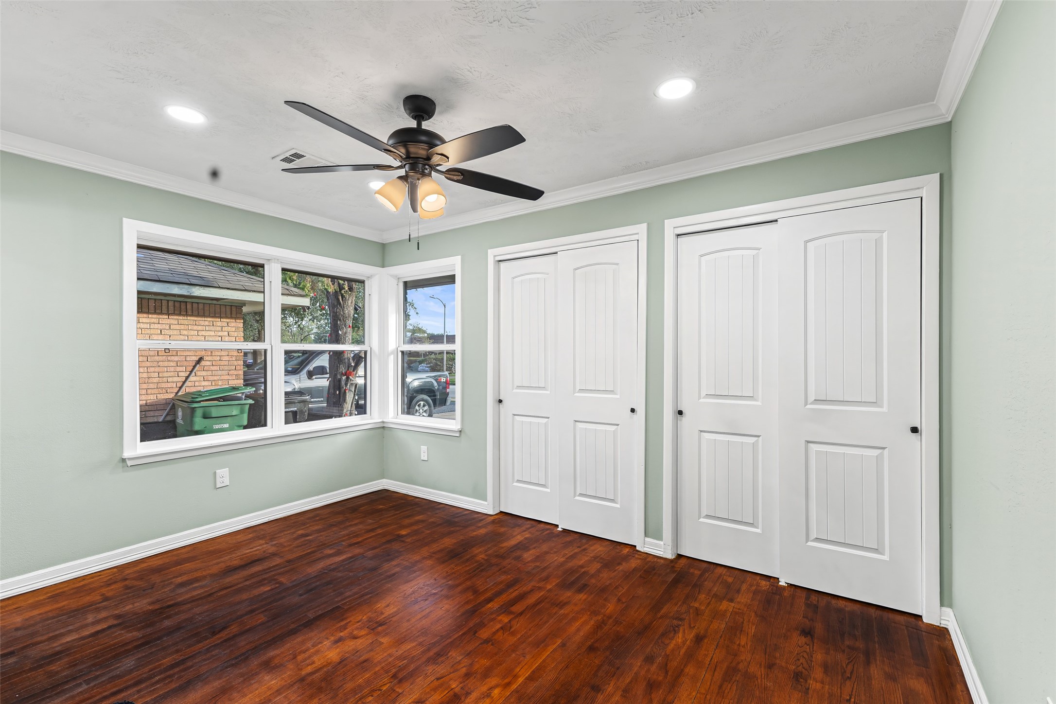 5402 Libbey Drive Houston, TX 77092 - Photo 28 of 43 a view of empty room with wooden floor and fan
