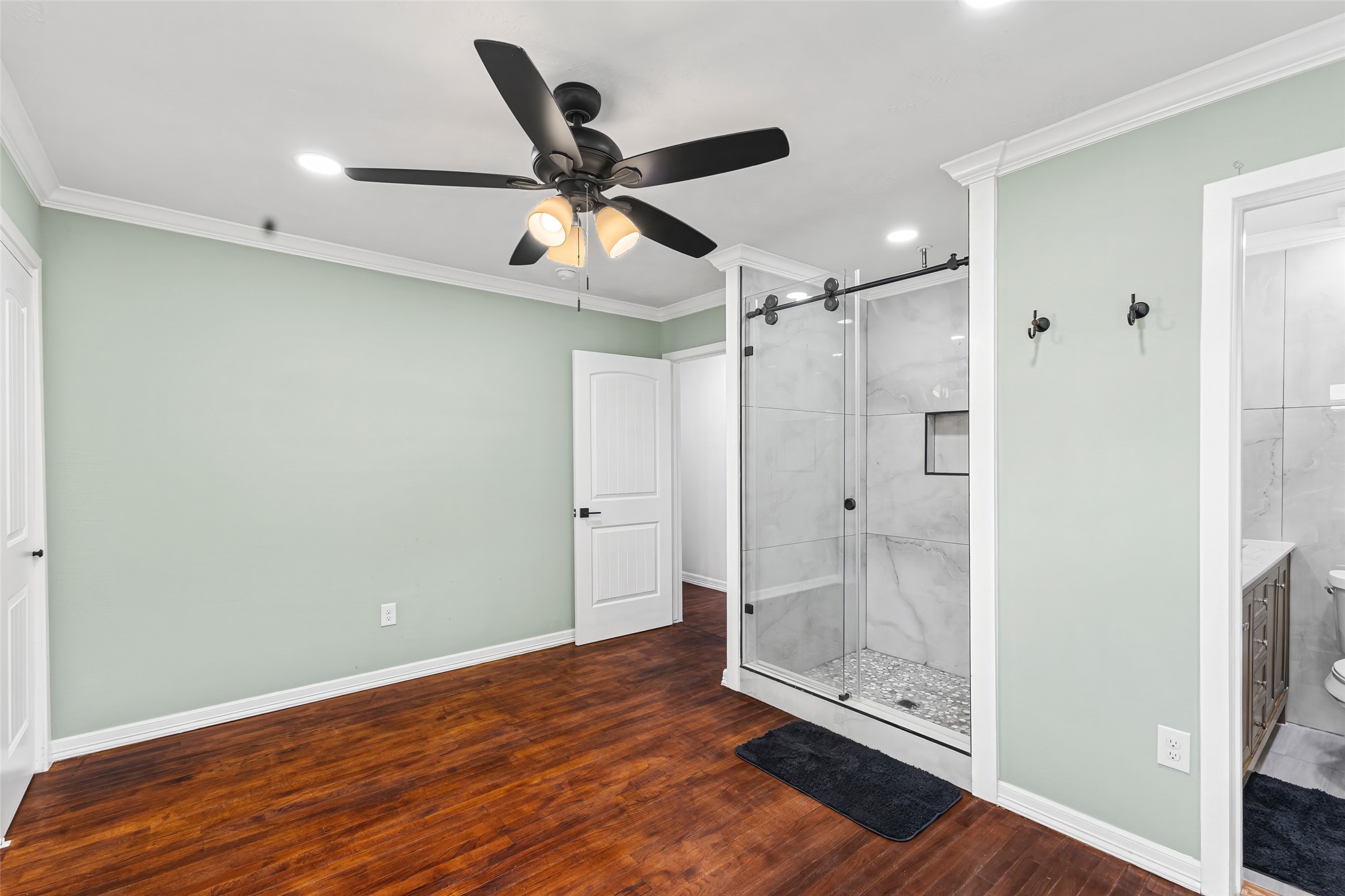 5402 Libbey Drive Houston, TX 77092 - Photo 29 of 43 a view of a hallway with wooden floor and staircase