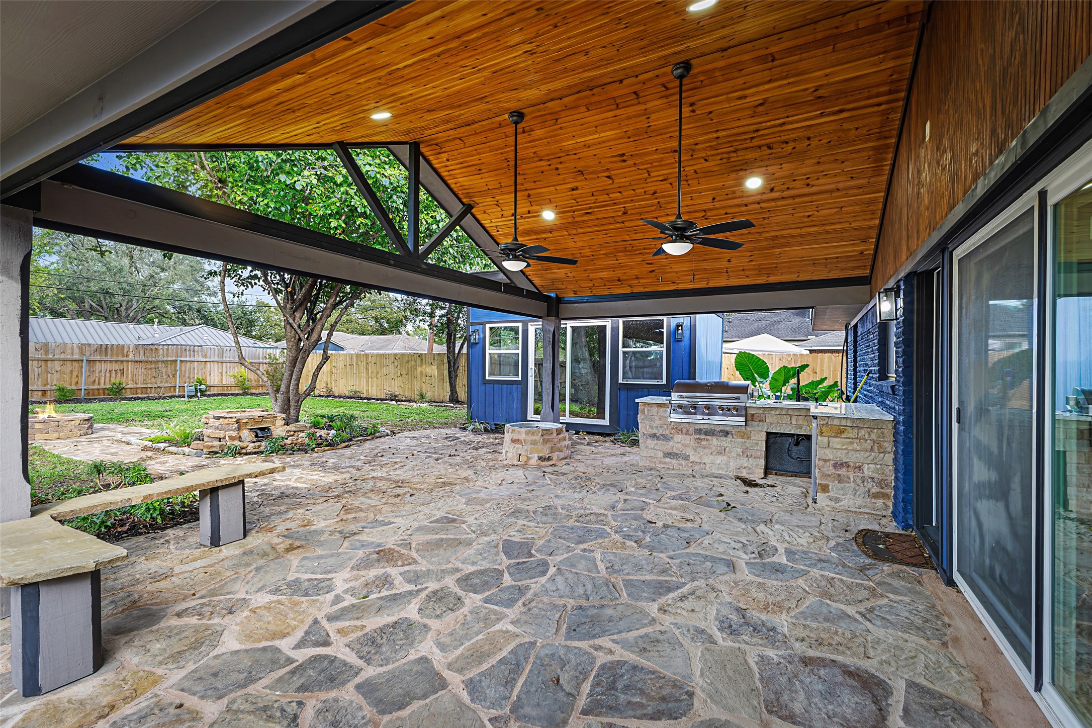 5402 Libbey Drive Houston, TX 77092 - Photo 32 of 43 a view of a porch with furniture and a yard