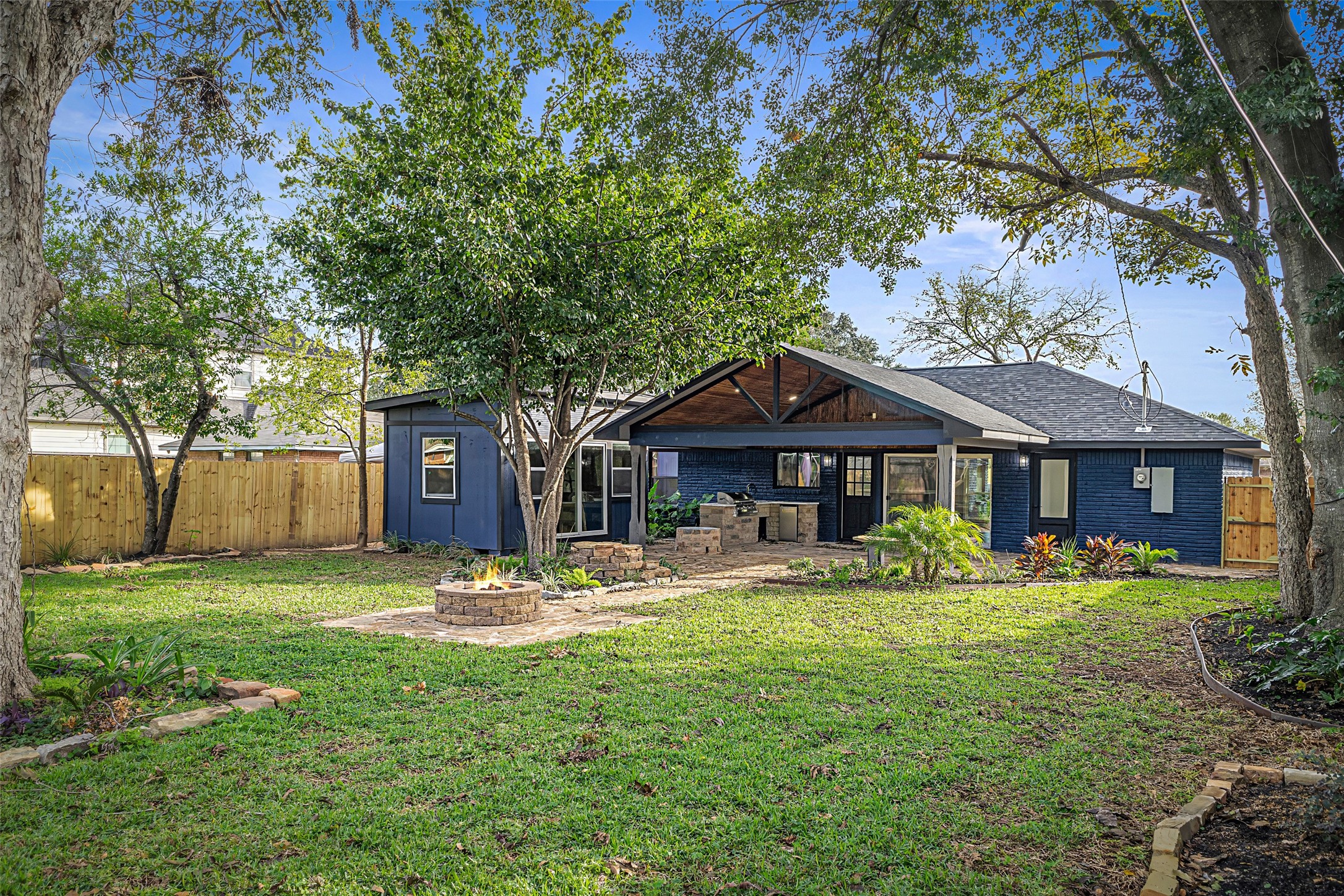 5402 Libbey Drive Houston, TX 77092 - Photo 39 of 43 a front view of a house with a garden