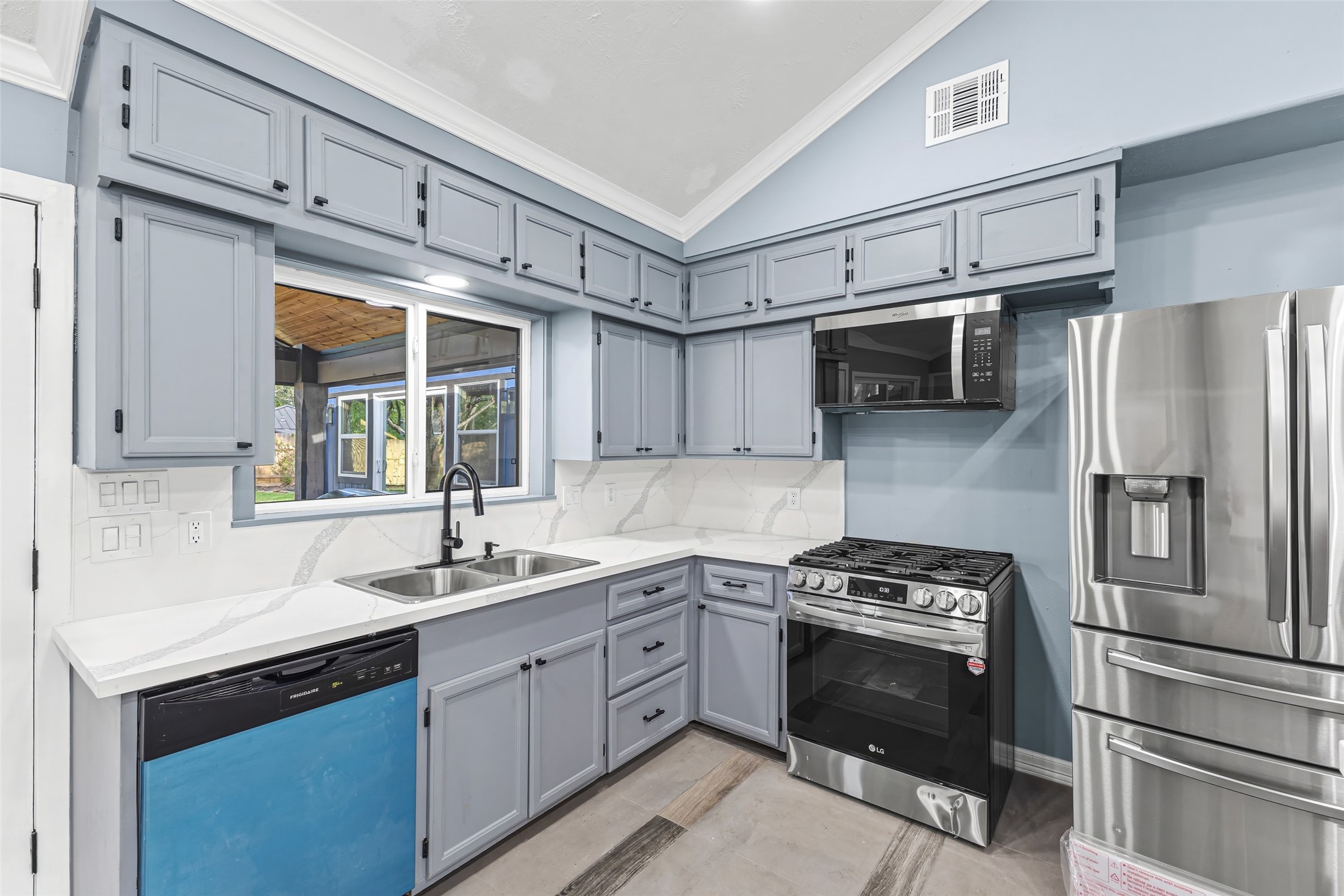 5402 Libbey Drive Houston, TX 77092 - Photo 9 of 43 a kitchen with a sink stove and refrigerator