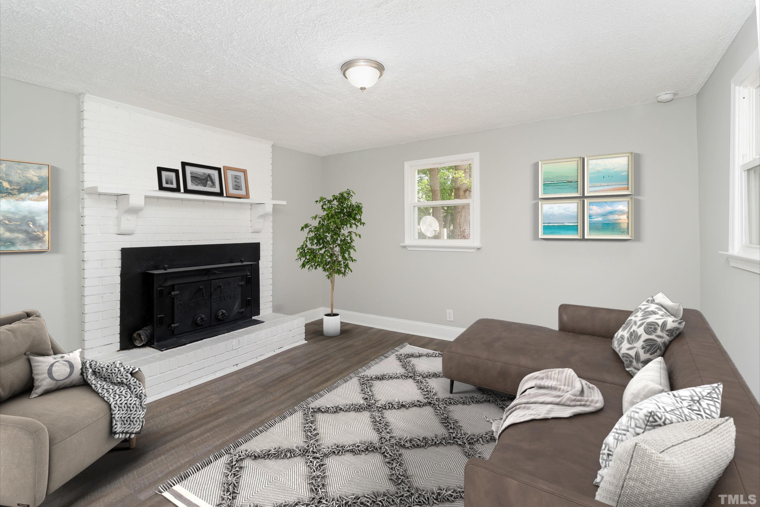 1510 Axum Road Garner, NC 27529 - Photo 11 of 22 a living room with furniture and a fireplace