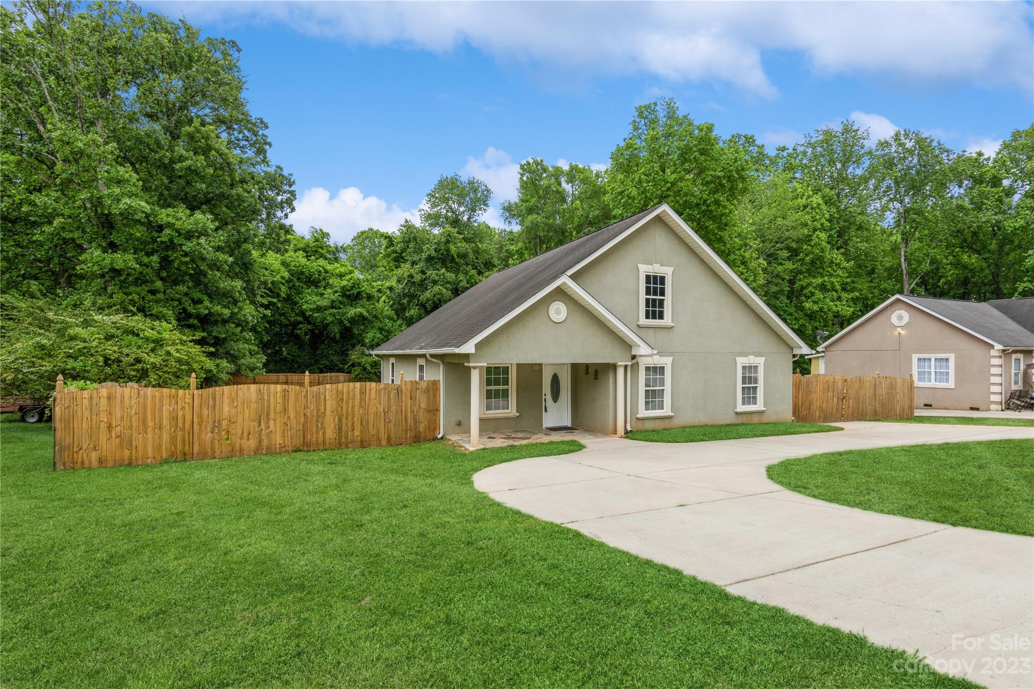 125 Rhyne Station Road Charlotte, NC 28214 - Photo 1 of 26 a view of a house with a yard and a garden