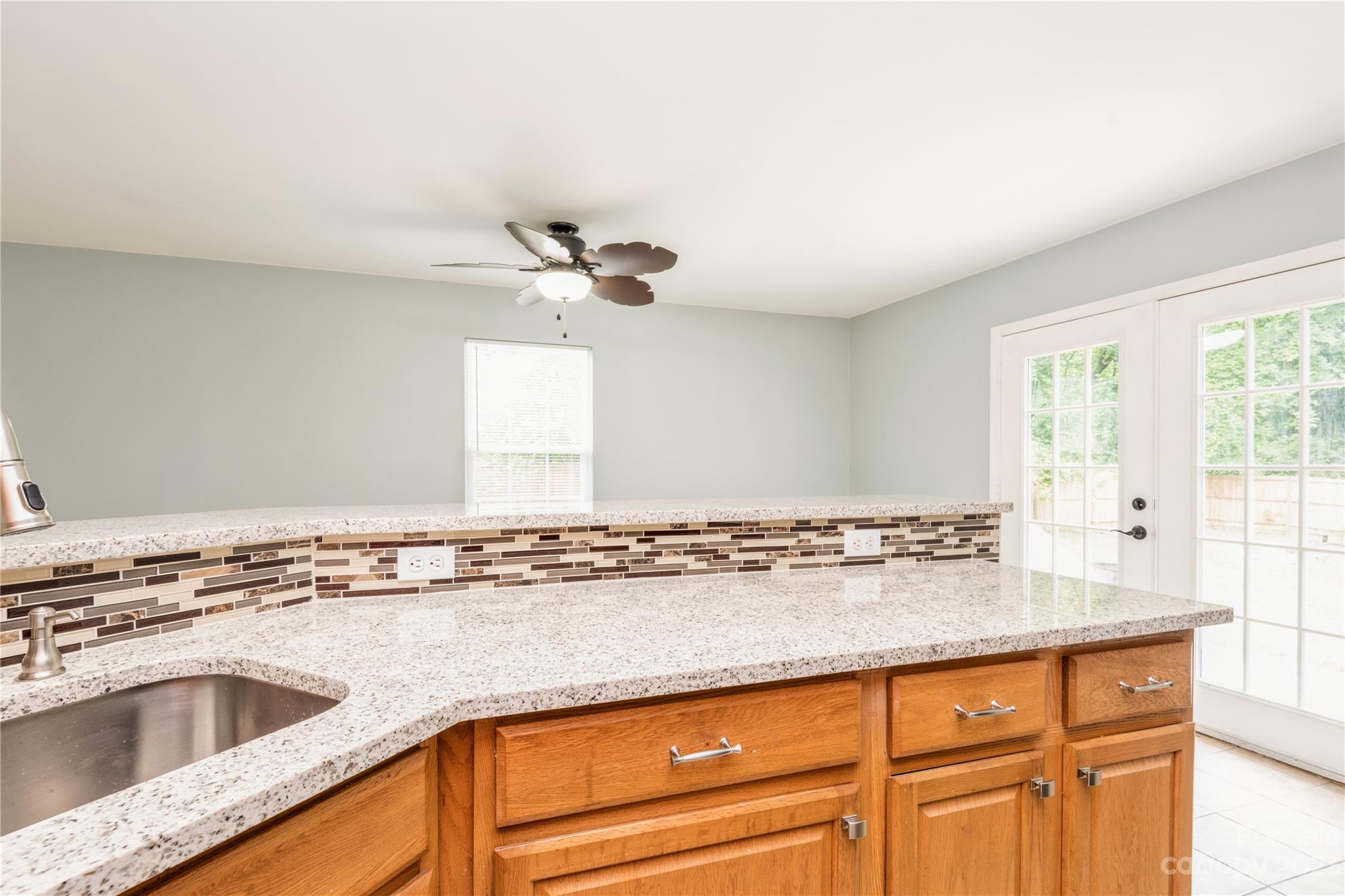 125 Rhyne Station Road Charlotte, NC 28214 - Photo 11 of 26 a view of a kitchen sink and natural light