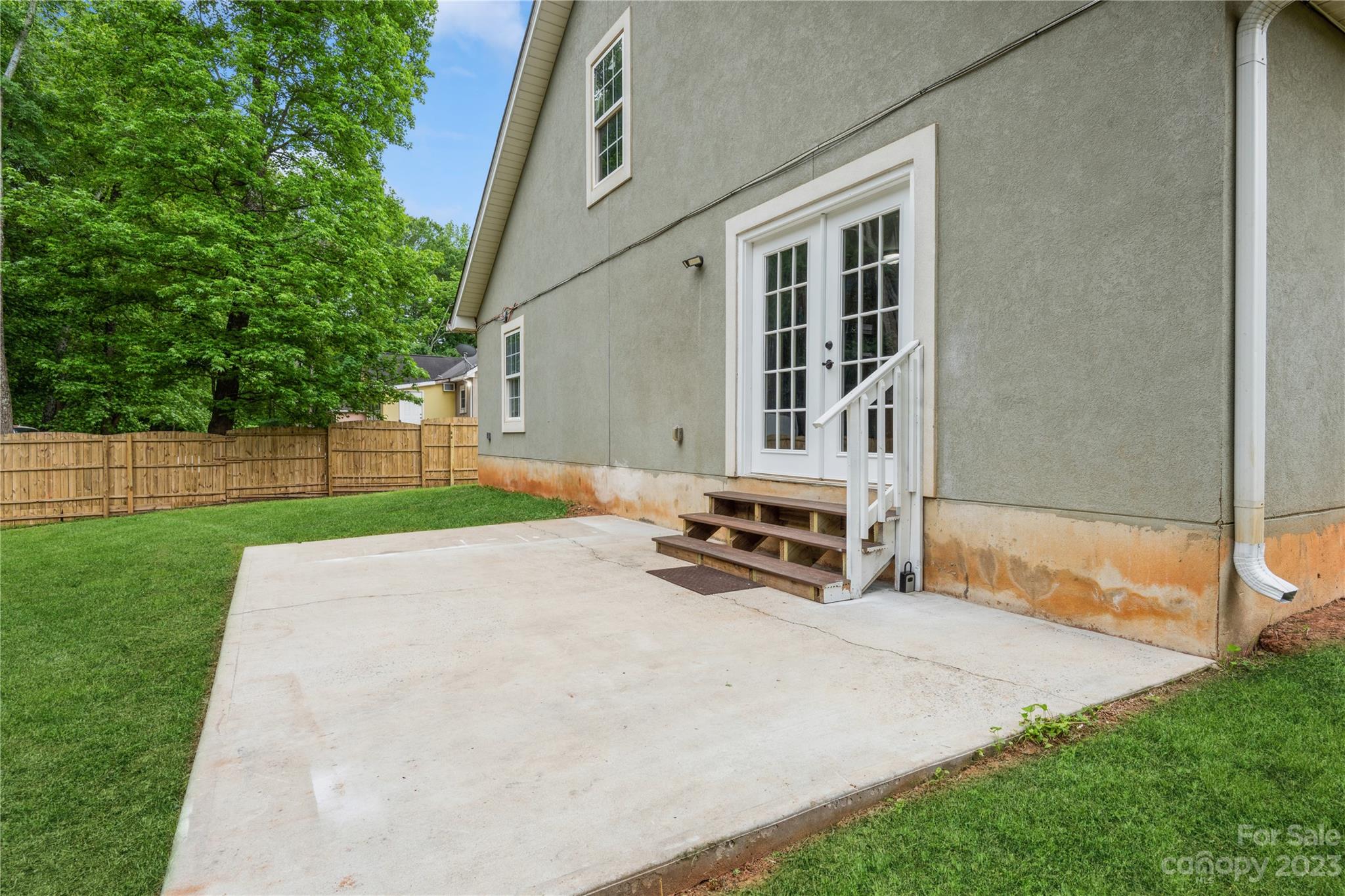 125 Rhyne Station Road Charlotte, NC 28214 - Photo 24 of 26 a view of a house with backyard and a tree