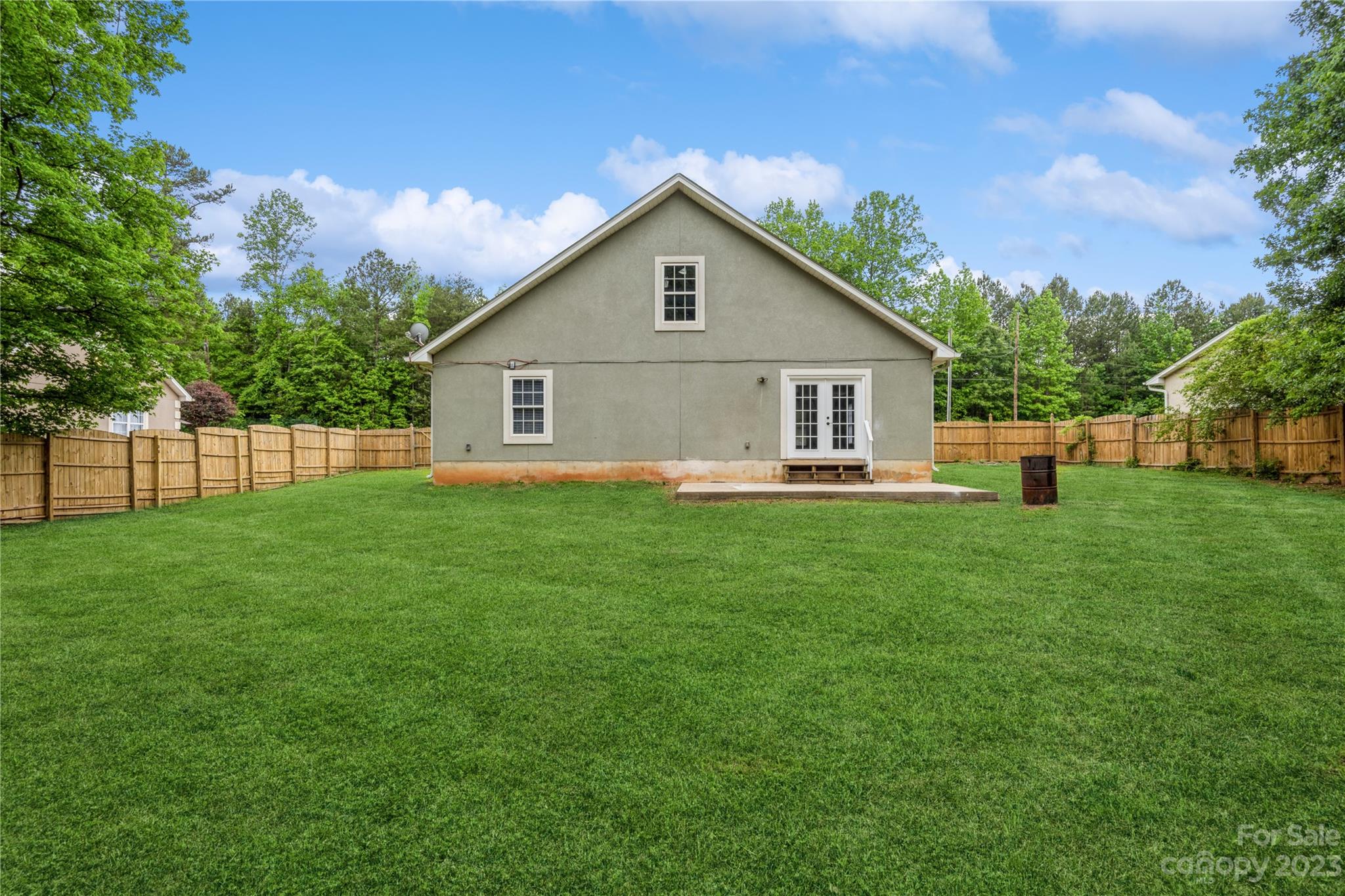 125 Rhyne Station Road Charlotte, NC 28214 - Photo 25 of 26 a front view of house with backyard and green space