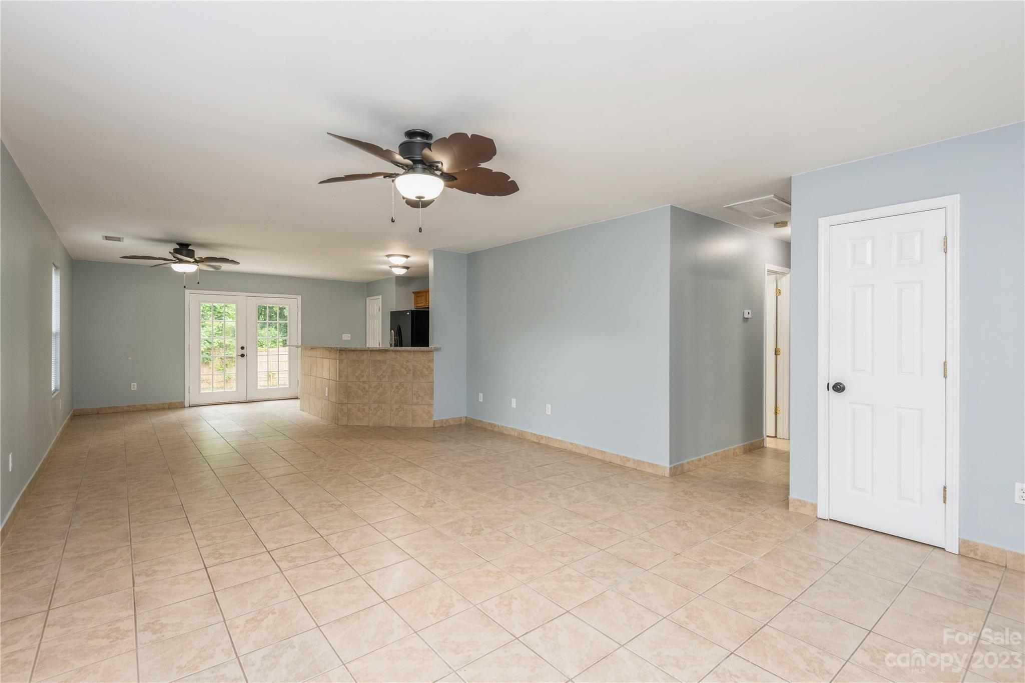 125 Rhyne Station Road Charlotte, NC 28214 - Photo 3 of 26 a view of a kitchen with a sink and a chandelier fan