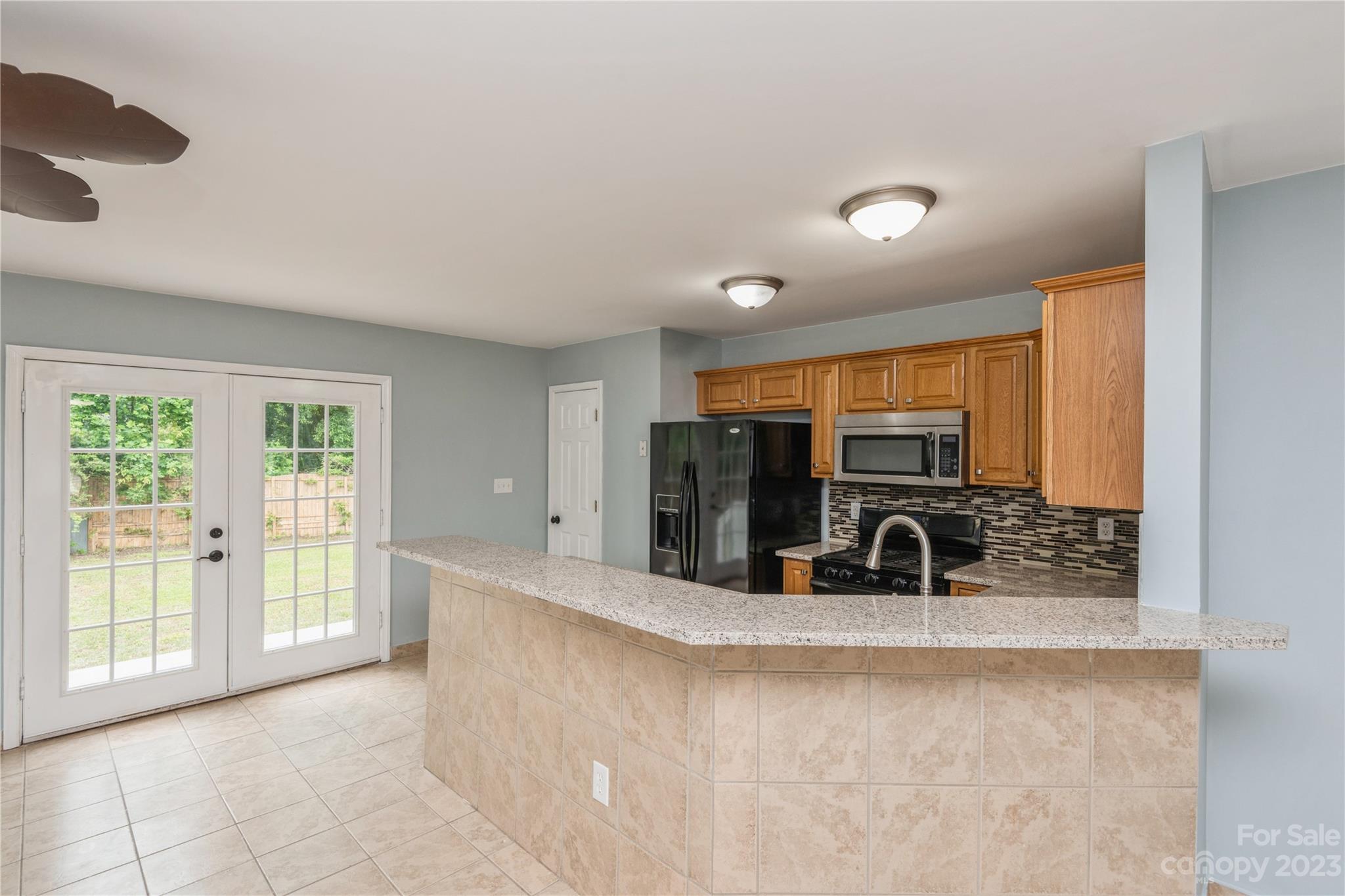 125 Rhyne Station Road Charlotte, NC 28214 - Photo 6 of 26 a view of a kitchen with a sink and a large window