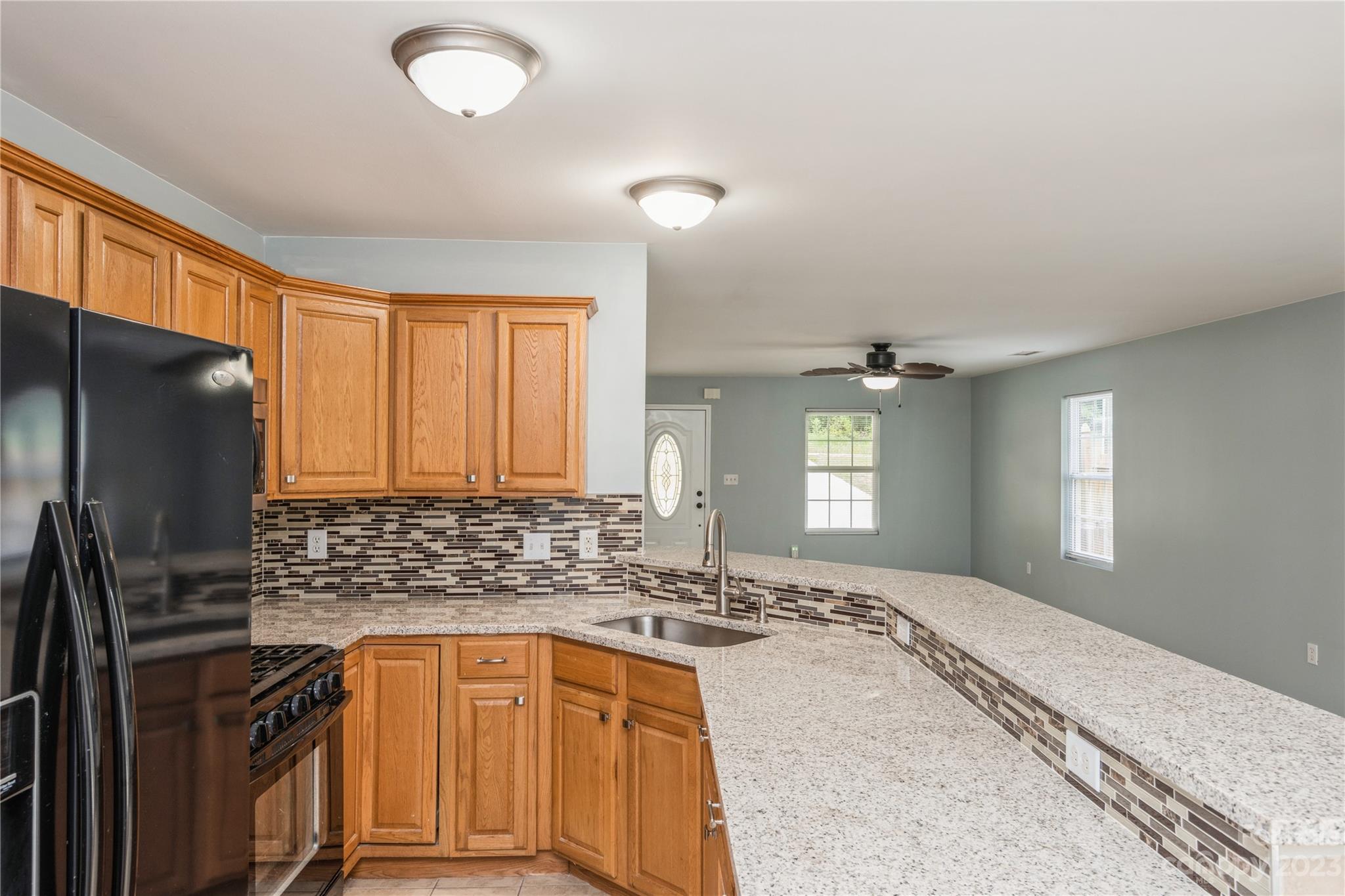 125 Rhyne Station Road Charlotte, NC 28214 - Photo 8 of 26 a kitchen with stainless steel appliances granite countertop a sink stove and refrigerator