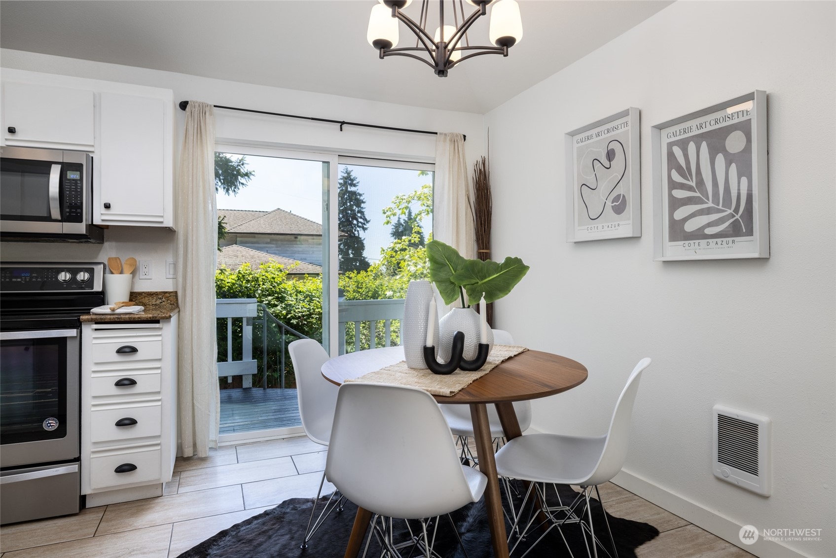 2131 North 88th Street Seattle, WA 98103 - Photo 14 of 28 a view of a dining room with furniture window and wooden floor