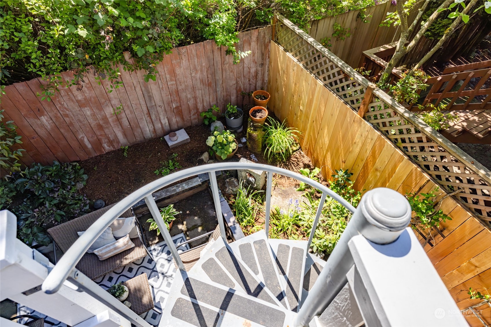 2131 North 88th Street Seattle, WA 98103 - Photo 18 of 28 a view of deck with furniture and garden