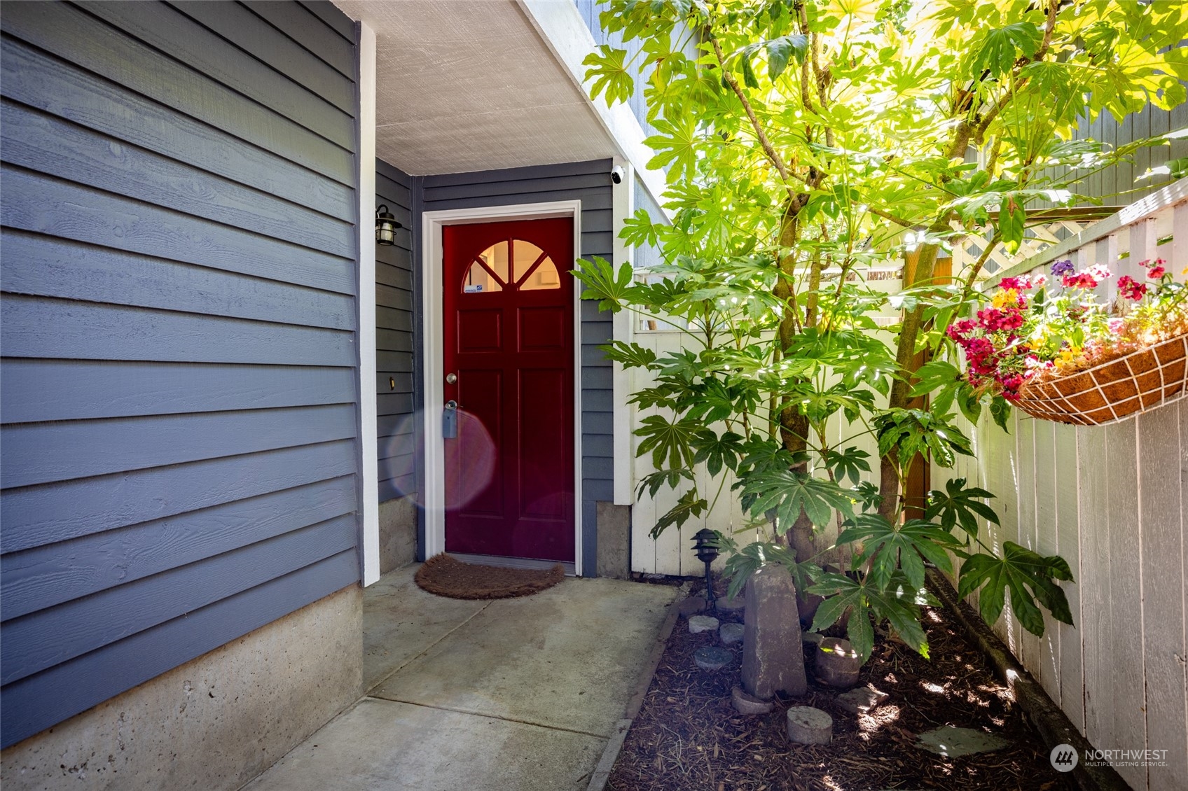 2131 North 88th Street Seattle, WA 98103 - Photo 3 of 28 a potted plant sitting in front of a door