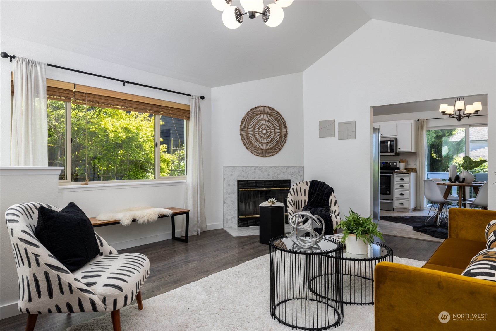 2131 North 88th Street Seattle, WA 98103 - Photo 4 of 28 a living room with furniture a fireplace and a large window