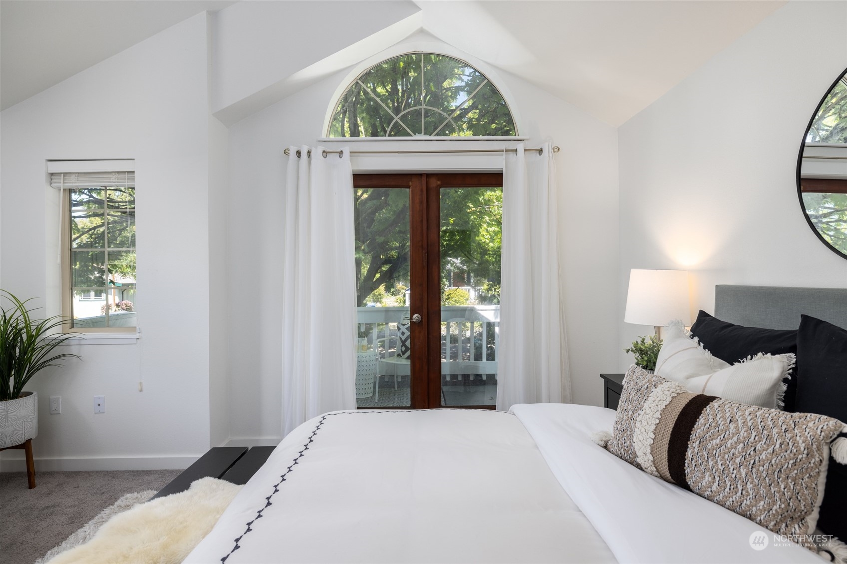 2131 North 88th Street Seattle, WA 98103 - Photo 8 of 28 a bedroom with a bed and a window