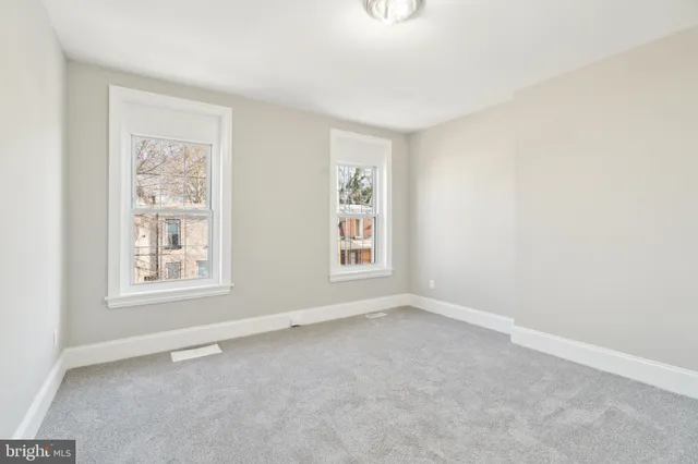 an empty room with windows