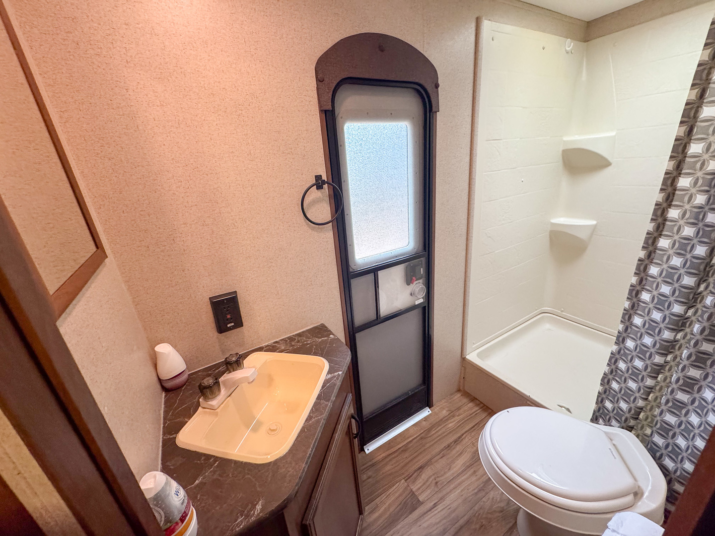 22-103 Woodhaven Sublette, IL 61367 - Photo 16 of 18 a bathroom with a toilet a sink and mirror