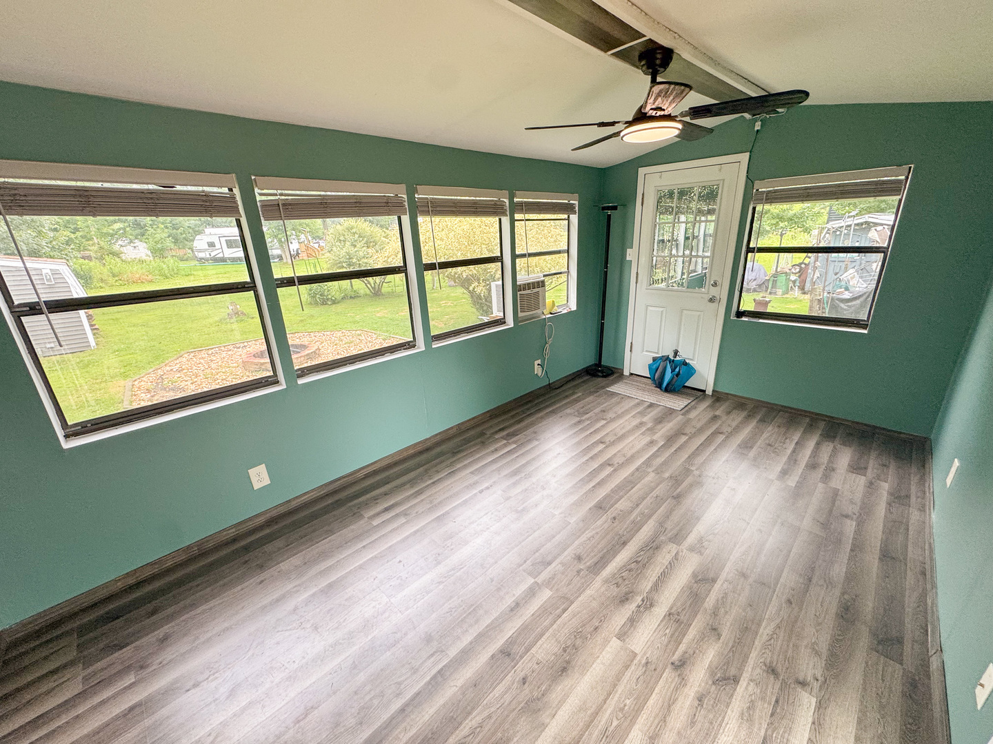 22-103 Woodhaven Sublette, IL 61367 - Photo 18 of 18 a view of an empty room with wooden floor and a window