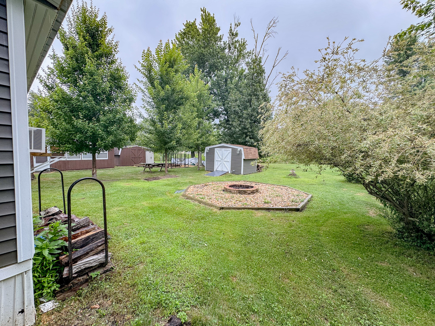 22-103 Woodhaven Sublette, IL 61367 - Photo 6 of 18 a view of a chairs in a backyard