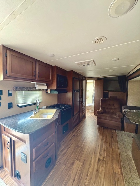 22-103 Woodhaven Sublette, IL 61367 - Photo 8 of 18 a kitchen with sink refrigerator and cabinets