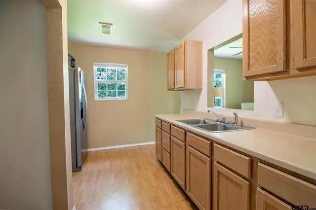 a kitchen with a sink and cabinets