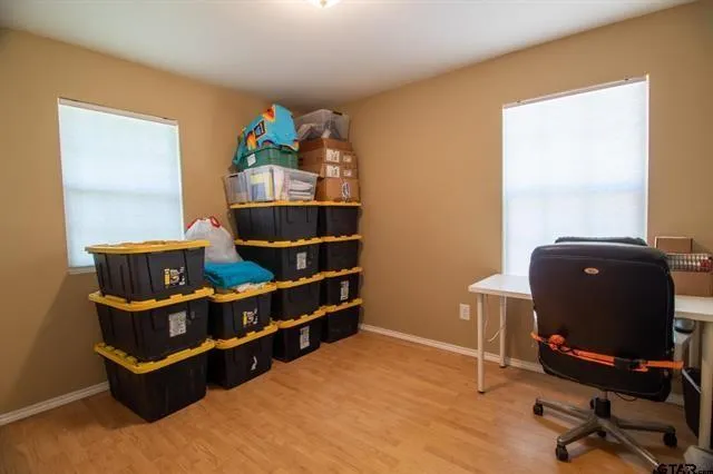 a view of workspace with lounge chair