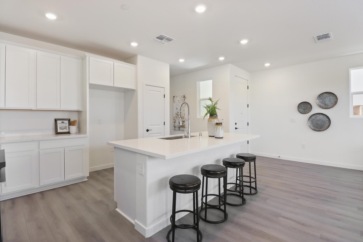 1108 Ashera Street Rocklin, CA 95765 - Photo 11 of 27 a kitchen with a table chairs sink and cabinets