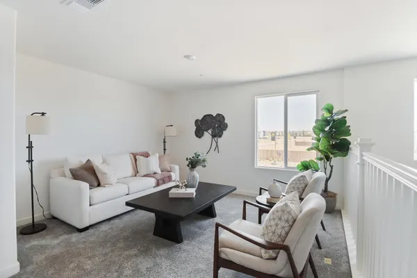 a living room with furniture and a window