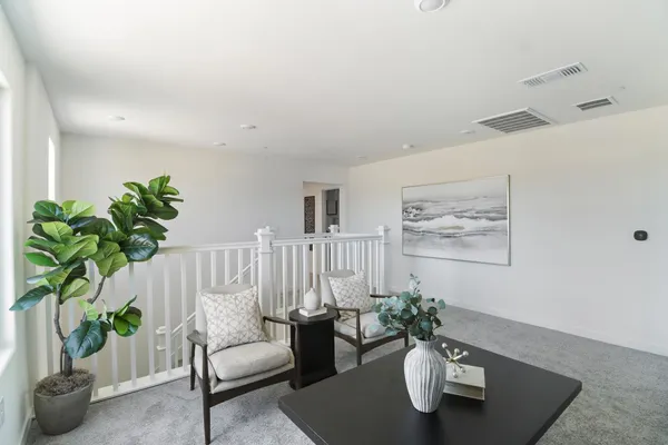 a view of a kitchen from the hallway