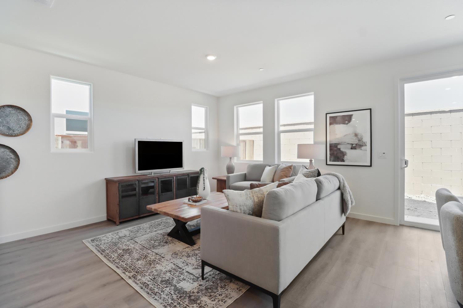 1108 Ashera Street Rocklin, CA 95765 - Photo 5 of 27 a living room with furniture and a flat screen tv