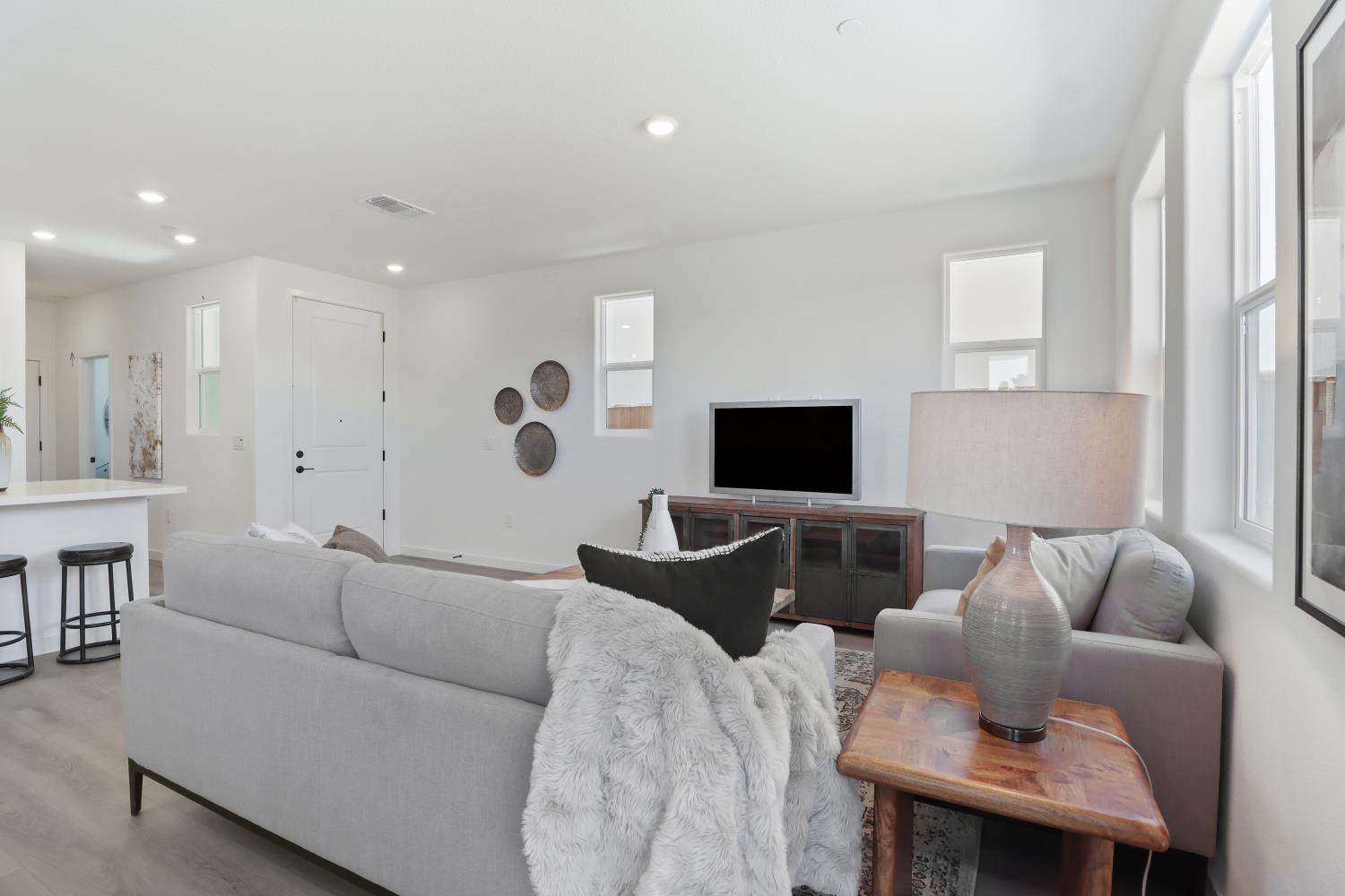 1108 Ashera Street Rocklin, CA 95765 - Photo 6 of 27 a living room with furniture and a flat screen tv