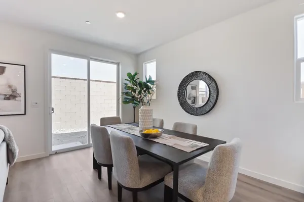 a view of a dining room with furniture window and wooden floor