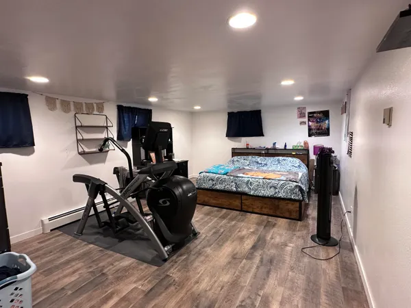a bedroom with bed and window