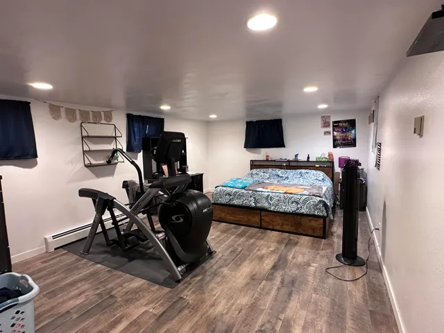 a bedroom with bed and window