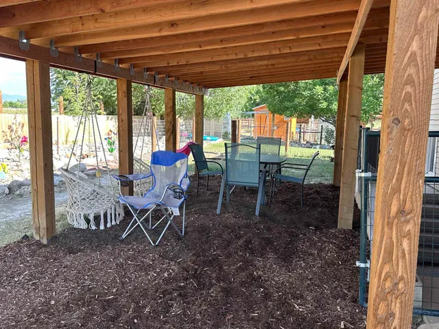 a huge green field with lots of trees